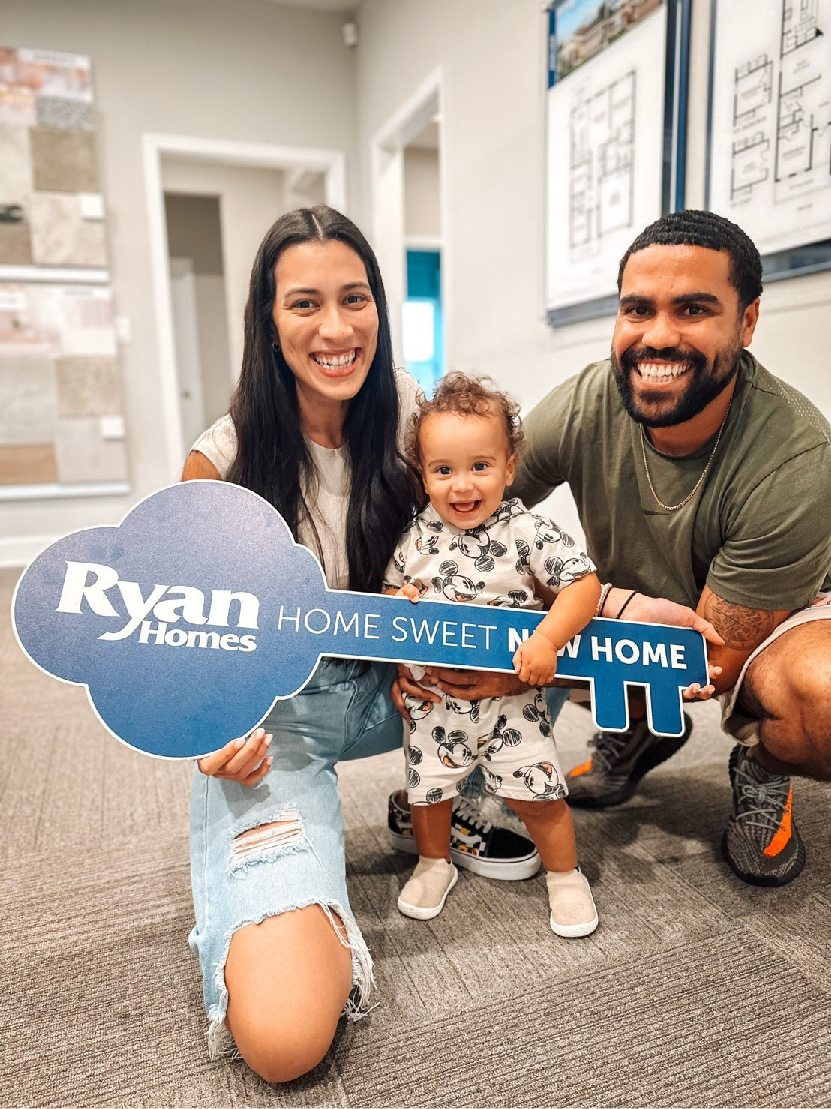 Family celebrating new home purchase with Ryan Homes