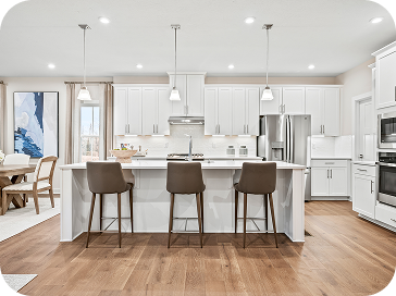 Modern Ryan Homes white kitchen with stainless steel appliances
