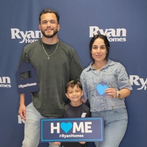 Family celebrating new home purchase with Ryan Homes